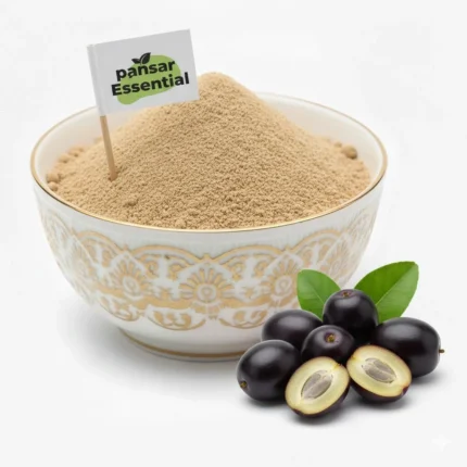 Jamun Guthli powder by Pansar Essential in a white bowl with fresh jamun fruit pieces.